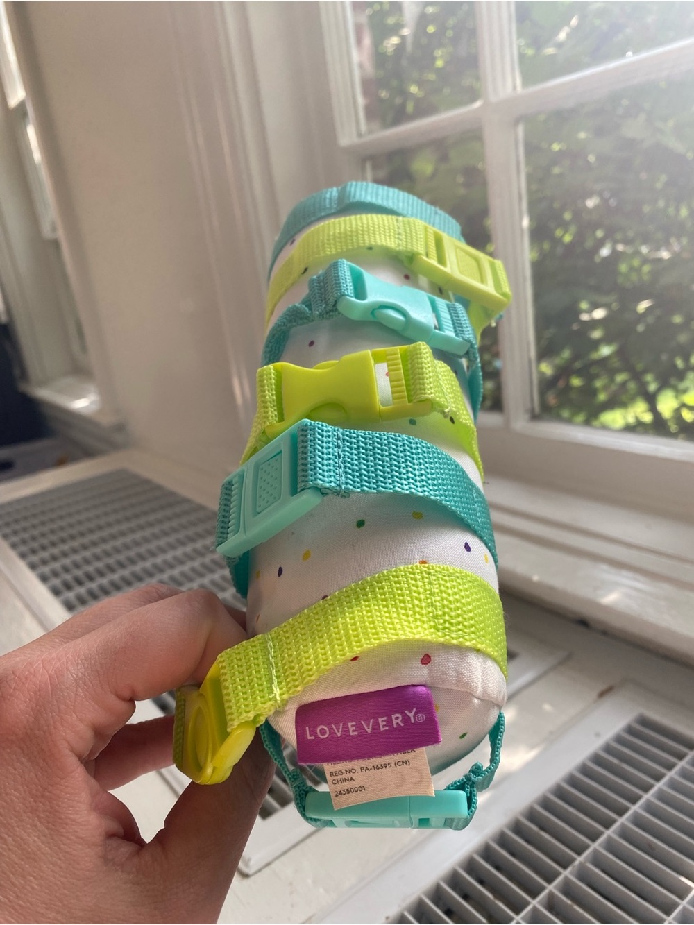 Lovevery Baby Wrist Rattle Toy in Teal & Neon Yellow